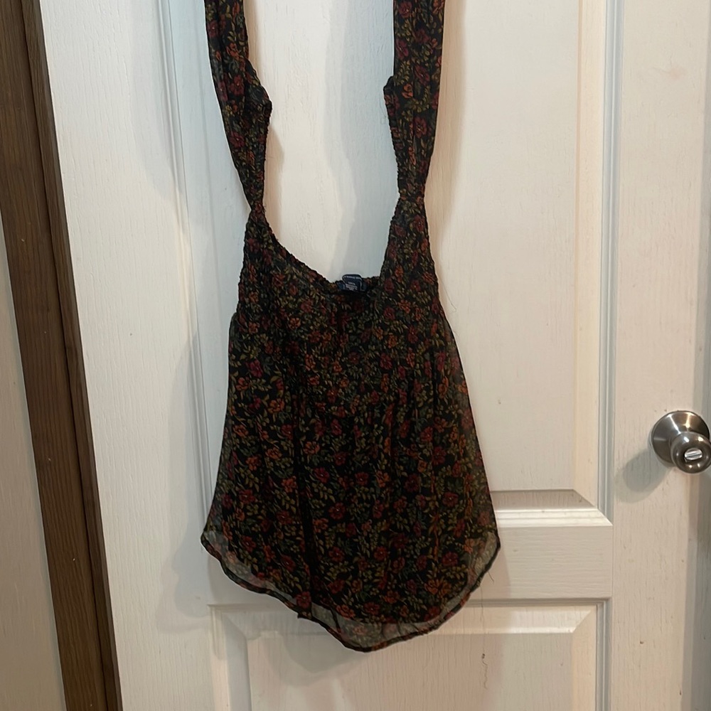 The straps above go on your arms. The shirt skips parts of your shoulder.